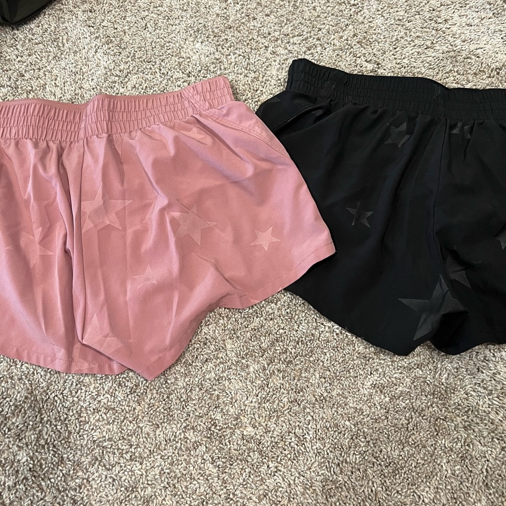 TWO athletic shorts with star detail